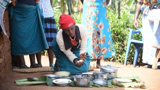 A cooking demonstration in Biguli subcounty under a Nutrition activity. Photo credit: AVSI