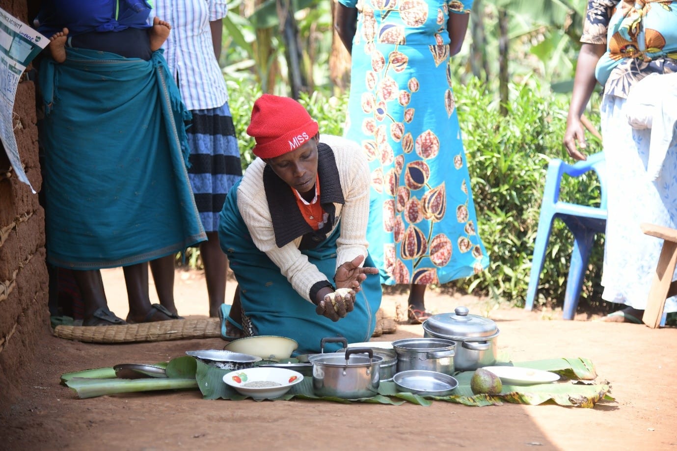 A cooking demonstration in Biguli subcounty under a Nutrition activity. Photo credit: AVSI